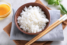 Bowl With Boiled White Rice On Grey Table