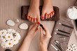 Young woman getting professional pedicure in beauty salon