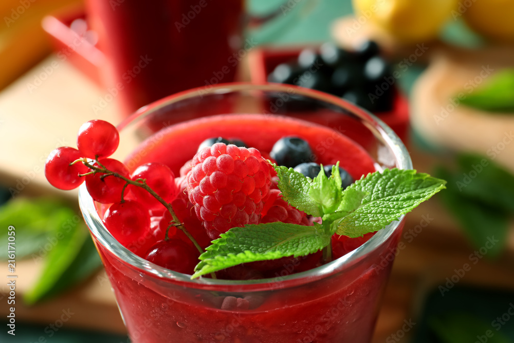 Glass with tasty berry smoothie, closeup