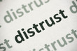 word distrust printed on paper macro