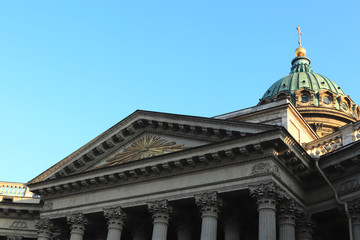 Facade of Kazan Cathedral. Saint-Petersburg. In the center is a silhouette of a shining pyramid.