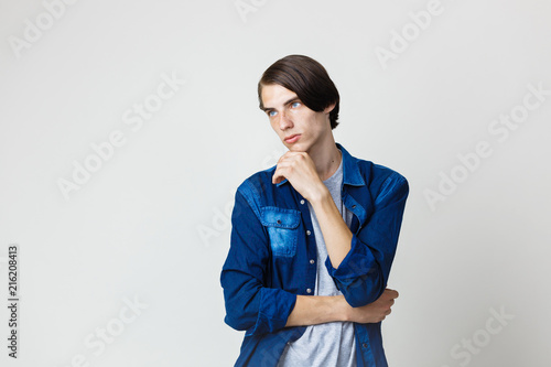 Thoughtful Handsome Young Thin Dark Haired Guy With Blue Eyes