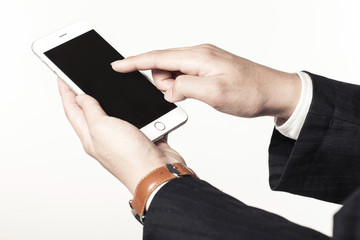 business man hand hold a mobile phone on the white background.