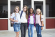 © Brocreative - Group of pre-adolescent school kids smiling while smiling together at school. Back to school photo of a group of girls