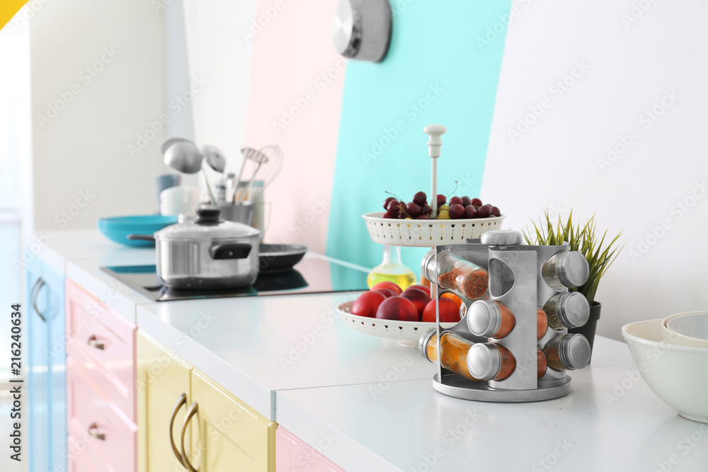 Set of spices on table in modern kitchen