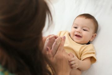 Poster - Loving mother playing with her baby at home