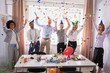 © Andrey Popov - Group Of Businesspeople Celebrating In Office