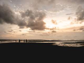 Sunset and cloudy beach.