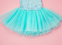 Top View Over The Girl Ballet Tutu Dress Over The Pink Background.