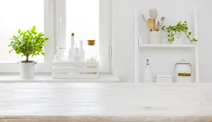 Wall Mural - empty table board and defocused modern kitchen window background concept