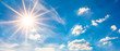Leinwandbild Motiv Hot summer or heat wave background, blue sky with glowing sun