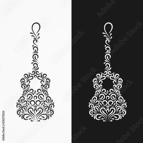 Foto Silhouette of a guitar of decorative ornate ornaments and curls on a black and w