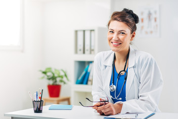 Wall Mural - Portrait of Woman Doctor at her Medical Office