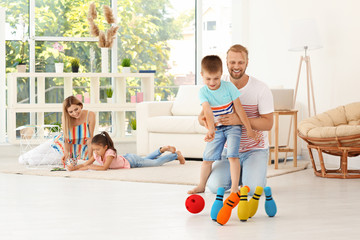 Wall Mural - Parents spending time with children at home