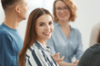 © Africa Studio - Young woman at group psychotherapy session indoors