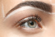 © Africa Studio - Young woman before procedure of eyebrows permanent makeup, closeup