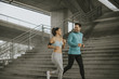 © BGStock72 - Young couple running in urban enviroment