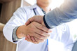 © Freedomz - Medicine and health care concept, Professional Male doctor in white coat handshake with patient after successful recommend treatment methods