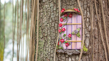 Wall Mural - Pink fairy door in a tree