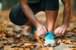 © Microgen - Woman Exercising Outdoors in The Fall