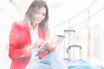 Wall Mural - Airport business woman on smart phone