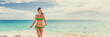 © Maridav - Vacation beach bikini happy woman running on blue ocean water background in tropical Caribbean travel destination panoramic banner. Summer lifestyle.