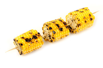 Wall Mural - corn grill on skewers on white background