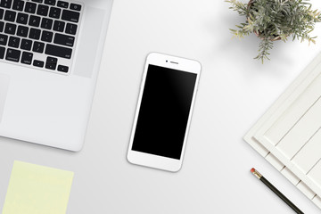 Poster - Phone on office desk beside laptop computer. Clean, flat lay composition for app design promotion.
