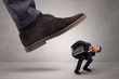 © ra2 studio - Young businessman illustrated inconsiderable by being trampled