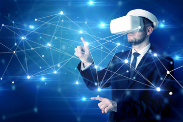 businessman in virtual reality goggles investigate global network connectivity concept