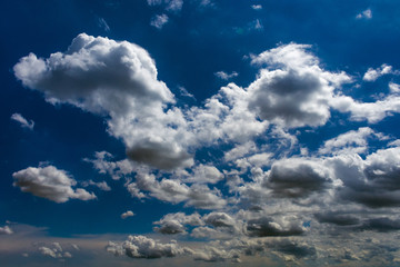 White fluffy clouds against a blue sky