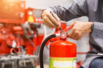 Engineer inspection Fire extinguisher in control room.