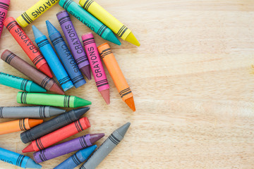 crayons drawing border multicolored on wooden background