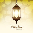 Ramadan Kareem - greeting card with hanging islamic lantern on golden bokeh background for Muslim Community festival. Bright lamp. Graphic design element for invitation, flyer. Vector illustration.