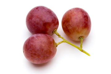 Ripe red grape isolated on white.