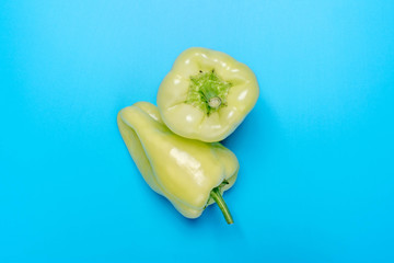 Natural Organic Green bulgarian bell pepper on trend blue background.Top view.Healthy food concept. Flat lay.Copy space. Minimalism style.Vegetables Vitamins  Rustic Style. Country Village Agriculture