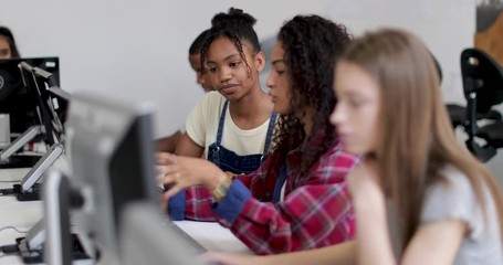 Students working together in a computer science class