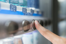 Finger Press Button On The Vending Machine