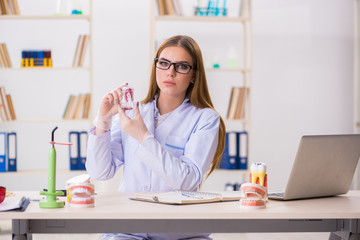 Dentistry student practicing skills in classroom