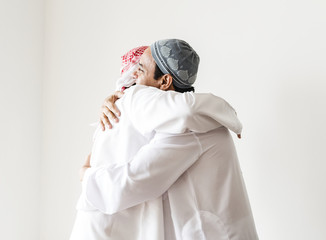 Muslim men hugging each other