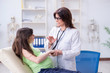 © Elnur - Pregnant woman visiting doctor for regular check-up