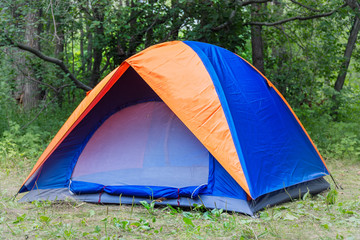 Tourist tent on the background of forest