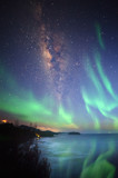 Fototapeta  - Milkyway with beautiful aurora Borealis. soft focus and noise due to long expose and high iso.
