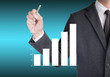 © anon - Business man drawing a growing graph