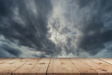 Empty Wooden Table And Dramatic Thunder Storm Clouds At Dark Sky