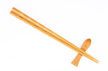 pair of wood chopsticks with wood holder isolated on a white background