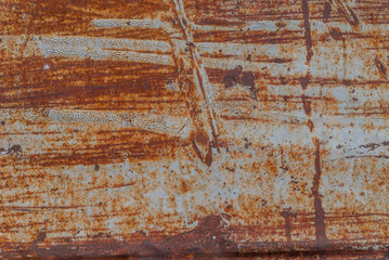 Wall Mural - painted iron surface with a large rusty and metal corrosion, old background with peeling and cracking paint as background, orange texture