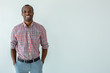 © shevchukandrey - Cheerful afro american man smiling against white background