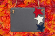 Autumn time in the USA with a chalkboard with a stars and fall leaves