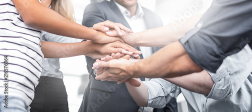 Fotomural Stack of hands. Unity and teamwork concept.